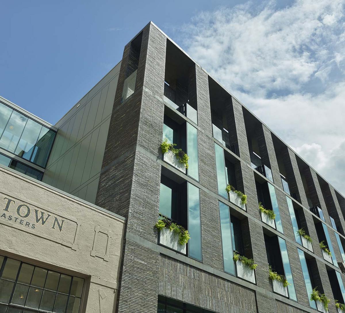 Winco's Series 3250 steel replica windows were used for the street level and single hung Winco Series 4410 windows with vertical mullions for the upper floors.