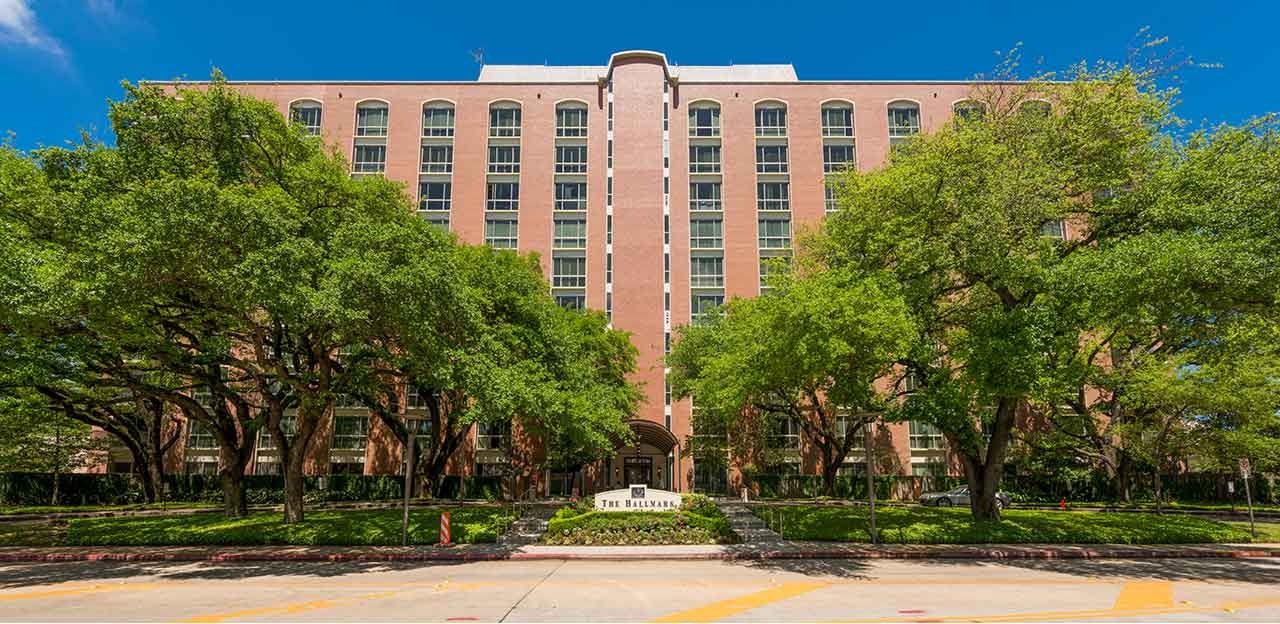 Front of building with trees in front of building