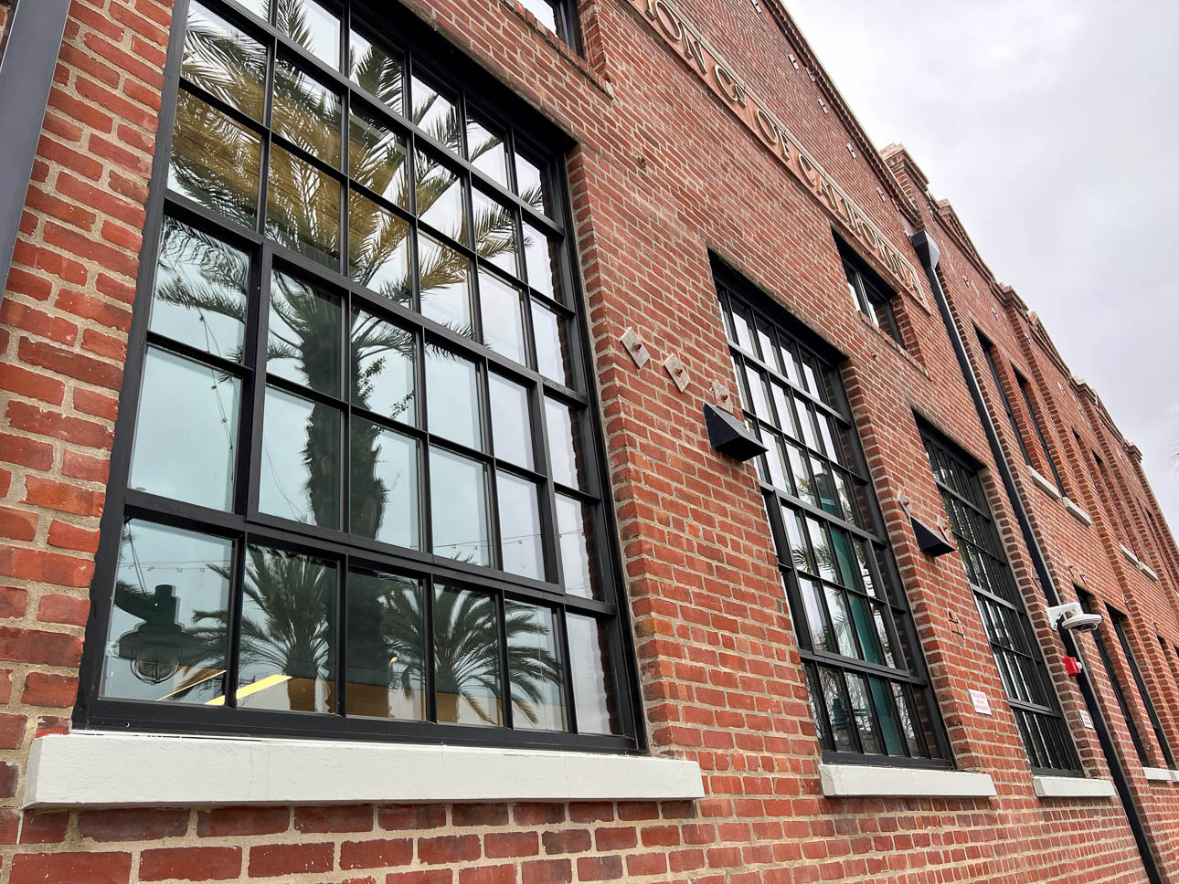 Side view of briack building with large windows