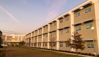 Beige building with sky in background