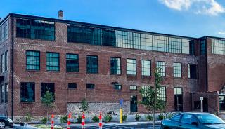 SteelCote Crossing_Close up of brick building with large windows