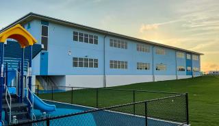 Side of blue building with windows